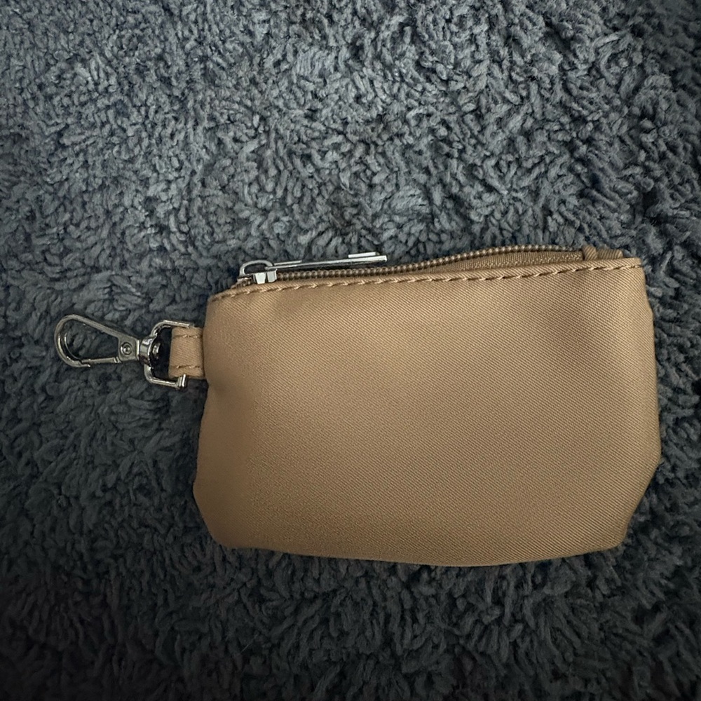 NWOT tan coin pouch with a clip